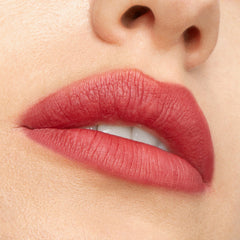 Rosy coral lips wearing Blush nβ Pout from ColourPop Cheek & Lip Set, showing smooth velvetyβmatte payoff; extreme close-up studio shot highlights even coverage and soft-focus finish around the mouth and nose.