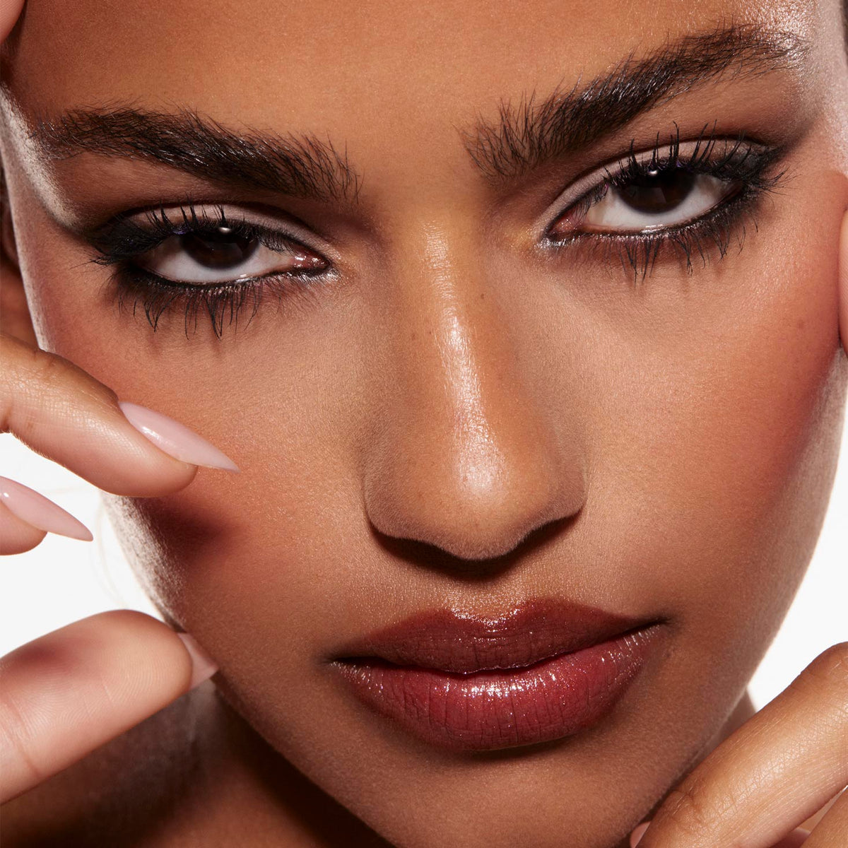 Smoky taupe-and-charcoal eye look created with the Stone Cold Fox Shadow Palette, a ColourPop Shadow Palette, defining the modelβs eyes with black liner and long lashes in a tight studio close-up with nude-gloss lips and manicured fingers framing.