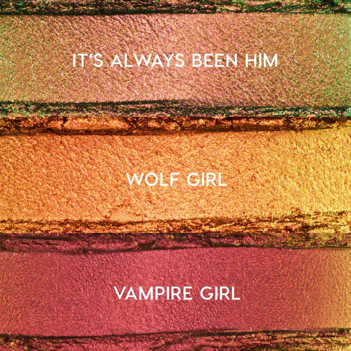 ColourPop Shadow Stix Love Triangle bundle swatches showing three metallic shades - It’s Always Been Him (pink‑green duochrome), Wolf Girl (copper gold), and Vampire Girl (rosy plum) - spread in horizontal strips on a textured makeup surface.