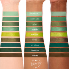 Three forearms display swatches of the ColourPop Shadow Palette Just My Luck, a monochrome green edit of nine shades - Chances Are…, Kiss My Hass, So-So, Big Banks, Mary Jane, Olive U, Act Natural, Too Matcha, Charmed - in matte and metallic finishes.