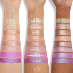 ColourPop Billionaire Jelly Much Shadow swatched on three arms in a gradient of shimmering shades, showcasing the metallic, high-shine eyeshadow finish and color payoff on multiple skin tones for US makeup lovers.