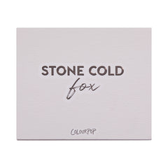 Stone Cold Fox shadow palette shown closed, featuring embossed “STONE COLD fox” lettering on a pale taupe faux-leather cover with ColourPop logo, studio-lit on a white background; a sleek neutral ColourPop Shadow Palette packaging shot.